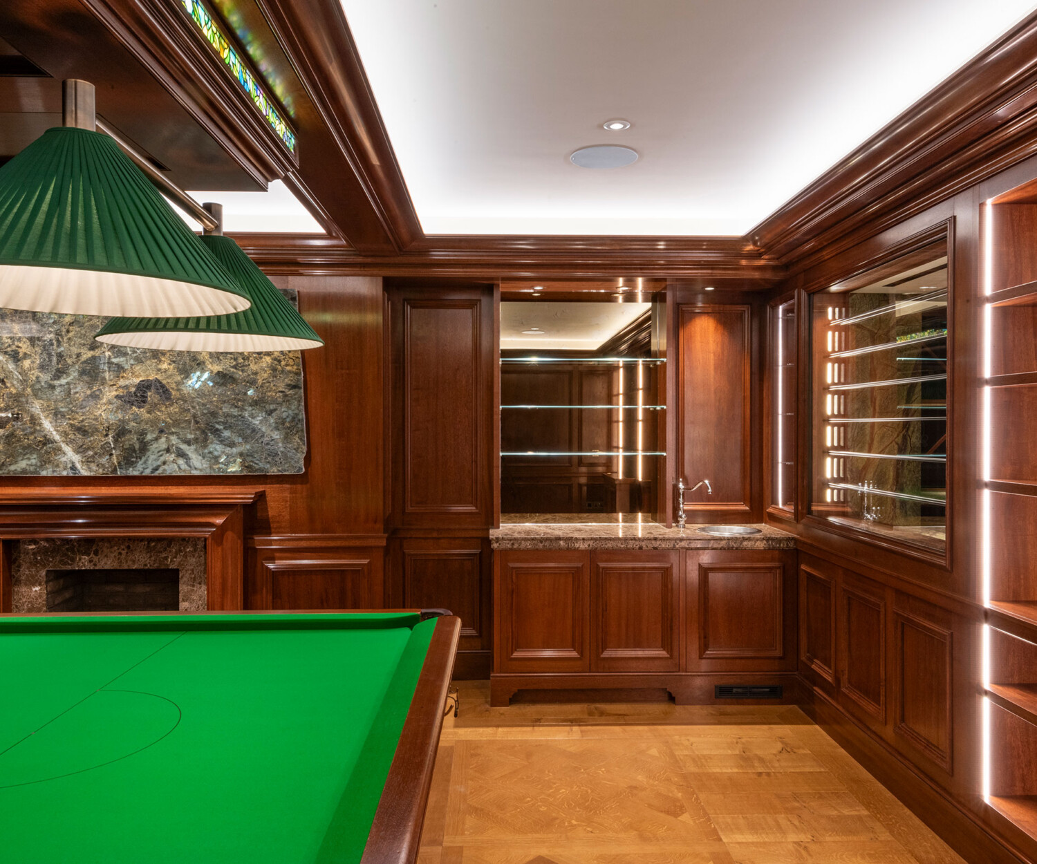 Traditional panelling in african mahoghany for an entertainment space and games room in a London home by William Garvey Bespoke furniture maker and designer