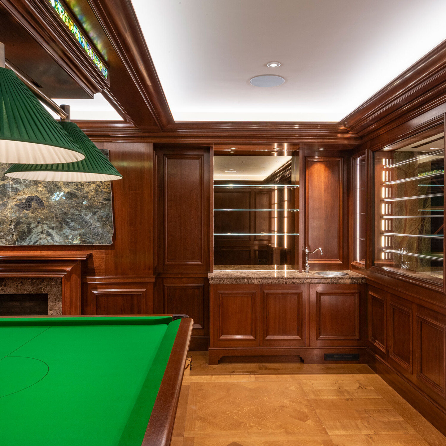 Traditional panelling in african mahoghany for an entertainment space and games room in a London home by William Garvey Bespoke furniture maker and designer