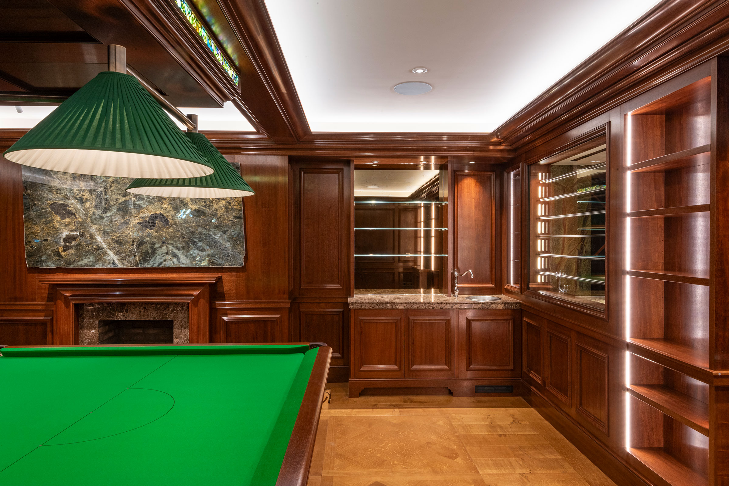 Traditional panelling in african mahoghany for an entertainment space and games room in a London home by William Garvey Bespoke furniture maker and designer