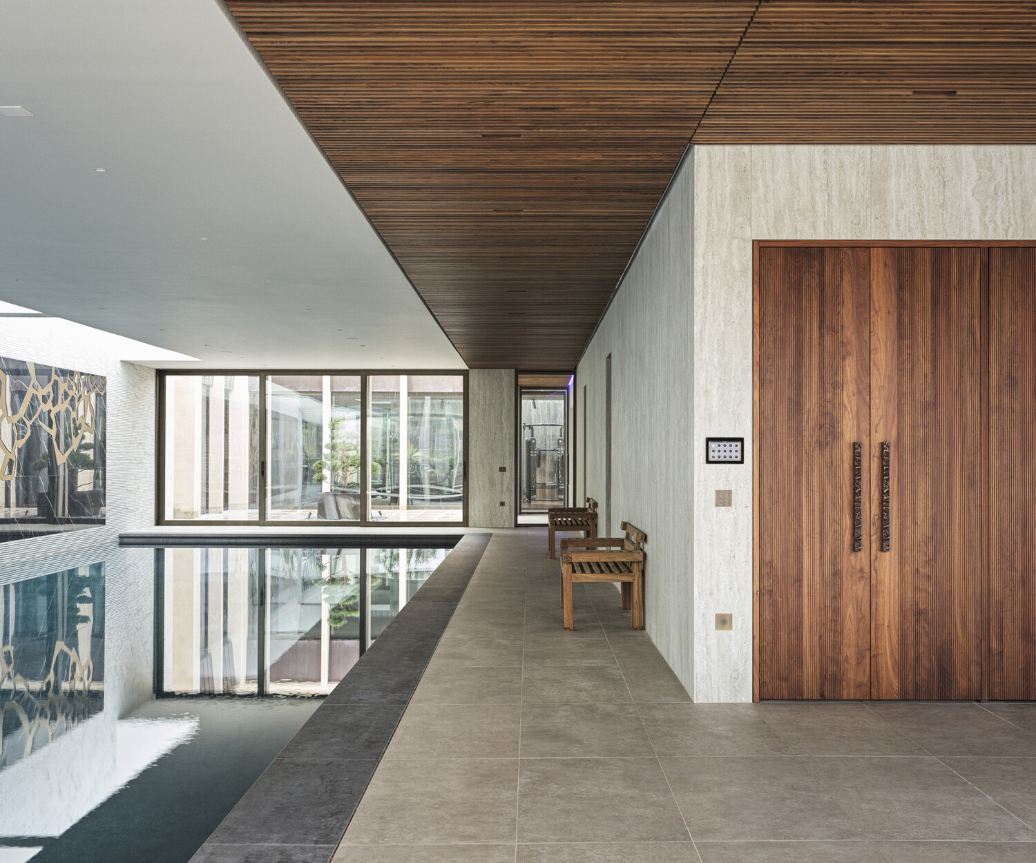 Bespoke waterproof walnut joinery and furniture by William Garvey British furniture designers and makers for the modern extension of a home in Somerset