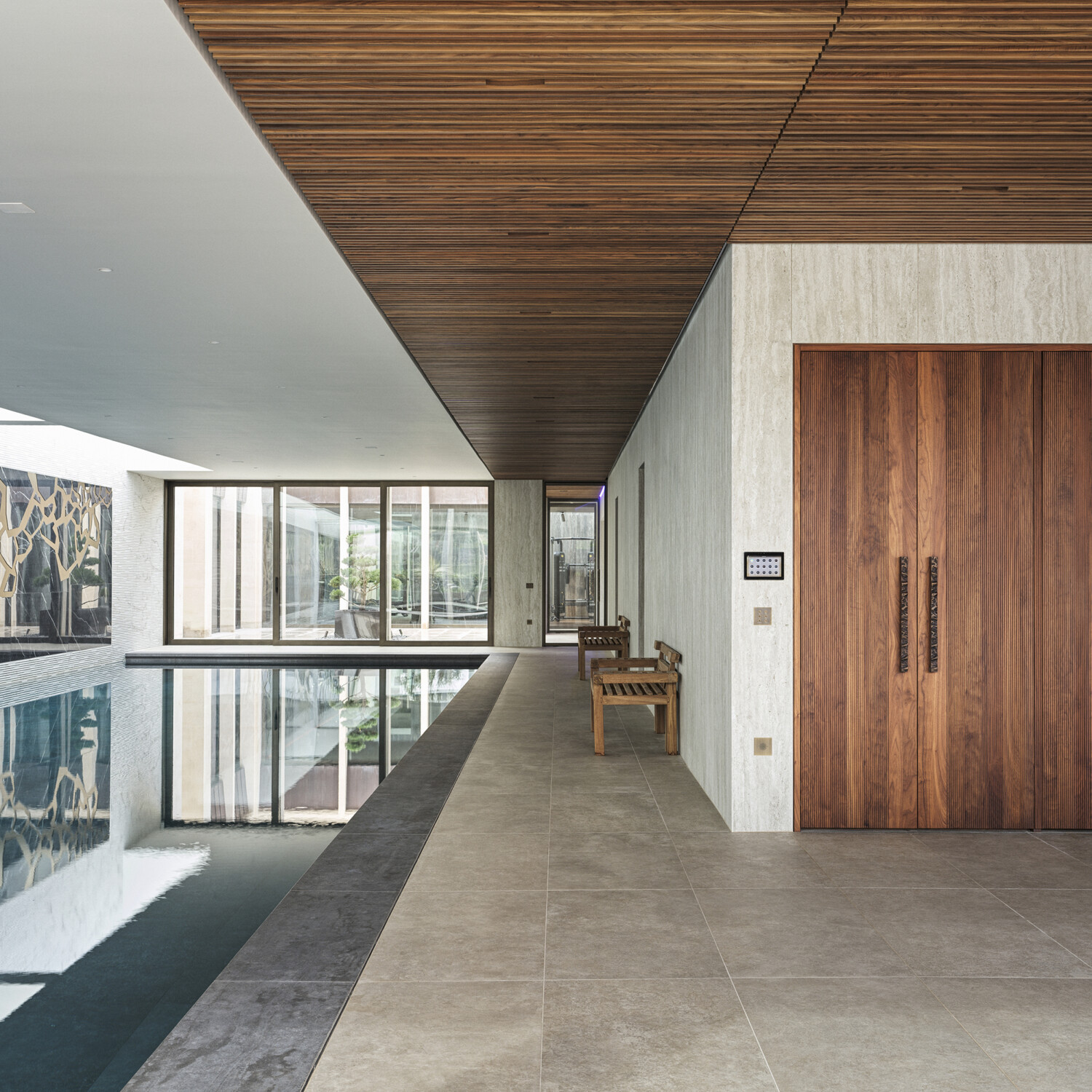 Bespoke waterproof walnut joinery and furniture by William Garvey British furniture designers and makers for the modern extension of a home in Somerset